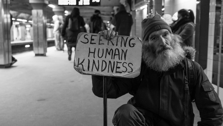 Homeless man with sign