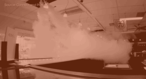 orange hue image of security fog in a jewellery store